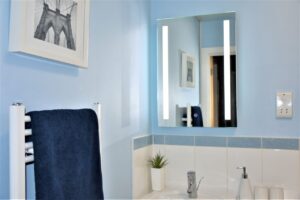 Holiday Accommodation Stratford upon Avon Bard's Nest Self Catering Bathroom Illuminated Mirror.